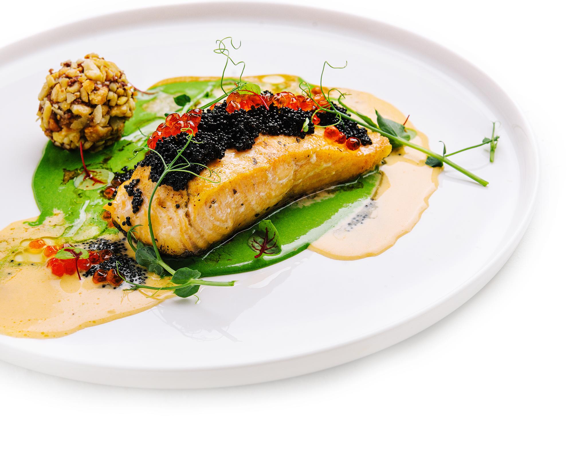 Plated fish with garnish and sauce